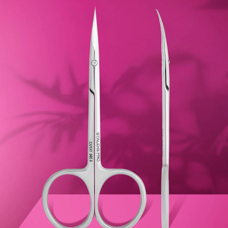 Professional cuticle scissors EXPERT 50 TYPE 3 with straight handle and ergonomic rings on pink background with shadow