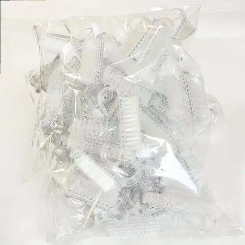 Bursten 50 St. transparent nail cleaning brushes in protective packaging, showing multiple white bristled brushes